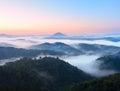 Autumn landscape. Gentle mist, magnificent autumn creamy fog above forests. High hill increased from fog Royalty Free Stock Photo