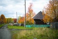 Autumn landscape, Golden trees and wooden old house, rural area, Russia Royalty Free Stock Photo