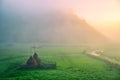 Autumn landscape with haystacks on the meadow at sunrise Royalty Free Stock Photo