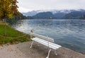 Autumn landscape. Lake Bled in November. White bench by the lake