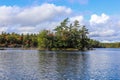 Autumn landscape with lake and blue cloudy sky .  Calm nature in the fall season. for background Royalty Free Stock Photo