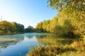 Autumn landscape of lake and bright trees