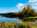 Autumn landscape by the lake, golden autumn, colorful trees and reflections Royalty Free Stock Photo