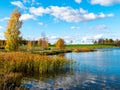 Autumn landscape by the lake, golden autumn, colorful trees and reflections Royalty Free Stock Photo