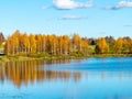 Autumn landscape by the lake, golden autumn, colorful trees and reflections Royalty Free Stock Photo