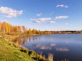 Autumn landscape by the lake, golden autumn, colorful trees and reflections Royalty Free Stock Photo