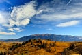 Autumn landscape with mountains and blue sky