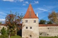 Autumn landscape with multicolored trees and city wall with tower in Berching, Bavaria Royalty Free Stock Photo