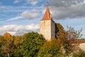 Autumn landscape with multicolored trees and city wall with tower in Berching, Bavaria Royalty Free Stock Photo