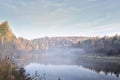 Autumn landscape mysterious foggy morning in a field near the river Royalty Free Stock Photo