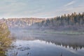 Autumn landscape mysterious foggy morning in a field near the river Royalty Free Stock Photo