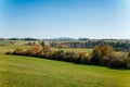 Autumn landscape near royal castle Tocnik, sunny day, Red and yellow leaves on trees, green fields and lawns, fresh green grass, Royalty Free Stock Photo