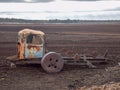 Autumn landscape with an old iron tractor in a peat bog Royalty Free Stock Photo