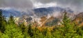 Autumn landscape, panorama, banner - view of mountains covered with mountain forests and meadows under autumn sky after rain Royalty Free Stock Photo