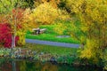 Autumn landscape with Park bench. River. Royalty Free Stock Photo