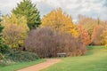 Autumn landscape with path and colourful trees. Royalty Free Stock Photo