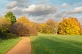 Autumn landscape with path and colourful trees. Royalty Free Stock Photo