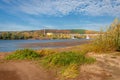 Autumn landscape river sandy shores, rifts and stretches, dark blue cold water, a sad time to catch eyes, a colorful farewell to