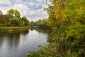 Autumn landscape with river and trees.