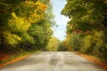 Autumn landscape with road and beautiful colored trees Royalty Free Stock Photo