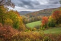 autumn landscape with rolling hills, colorful foliage, and peaceful solitude