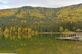 Autumn landscape. Saint Ana lake in Romania, the only volcanic lake in Europe, formed in a crater of a dead volcano Royalty Free Stock Photo