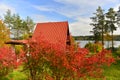 Autumn lanscape with wooden summer cottage and a lake Royalty Free Stock Photo