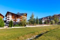 Autumn landscape trees, houses and mountains Royalty Free Stock Photo