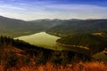 Colors of autumn in a landscape on the mountains. Vidra lake, at sunset - landmark attraction in Romania. Autumn background Royalty Free Stock Photo