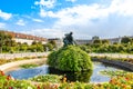 Autumn landscape of the Volksgarten with a view of an ancient marble fountain in front of The Hofburg