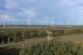 Autumn landscape with wind farm and electricity pylon Royalty Free Stock Photo