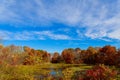 Autumn Landscape. Yellow Trees, Blue Sky and Lake. Nature Scenery in Fall. Royalty Free Stock Photo