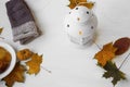 Autumn lantern with leaves and hand-warmers