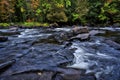 Autumn leaf colour with a long exposure of stream and flowing water Royalty Free Stock Photo