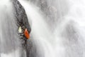 Autumn leaf in waterfall