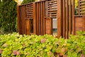 Autumn leaves on a beautiful pergola background.Fancy outdoor front yard.Wooden wall.