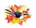 Autumn leaves, berries, writing supplies: pen, pencil, ruler, eraser rubber, ink bottle. Watercolor for school design