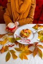 Autumn leaves cup coffee thanksgiving fruit woman hands hold cake red yellow Royalty Free Stock Photo