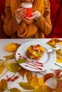 Autumn leaves cup coffee thanksgiving fruit woman hands hold cake red yellow Royalty Free Stock Photo