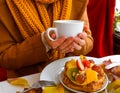 Autumn leaves cup coffee thanksgiving fruit woman hands hold cake white red yellow Royalty Free Stock Photo