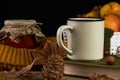 Autumn leaves, cup of coffee, warm scarf, fruits basket Royalty Free Stock Photo