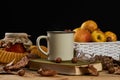 Autumn leaves, cup of coffee, warm scarf, fruits basket Royalty Free Stock Photo