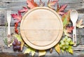 Autumn leaves and empty cutting board food fall background concept Royalty Free Stock Photo