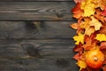Autumn leaves and pumpkin over old wooden background Royalty Free Stock Photo
