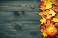 Autumn leaves and pumpkin over old wooden background Royalty Free Stock Photo