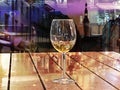 Autumn leaves rainy city glass of wine on table top at restaurant in windows reflection in Tallinn Estonia