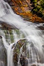 Autumn leaves surround part of the dramatic falls of Whitewater in NC Royalty Free Stock Photo