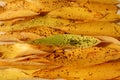 Autumn leaves. Texture template for poster, banner, postcard. Horizontal bright yellow long tree leaves lying on top of each other