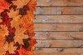 Autumn leaves on a wooden background with a copy of the text space. The concept of autumn, the change of seasons. Cold weather in Royalty Free Stock Photo