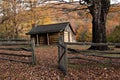 Autumn Log Cabin with Rail Fence Royalty Free Stock Photo